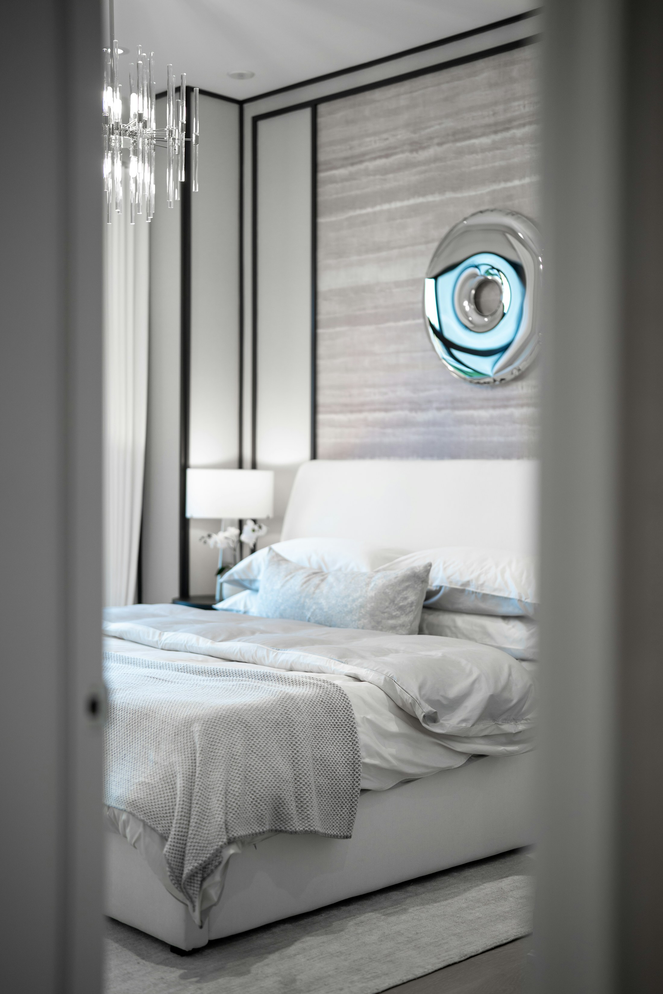 A quiet bedroom softened for the evening